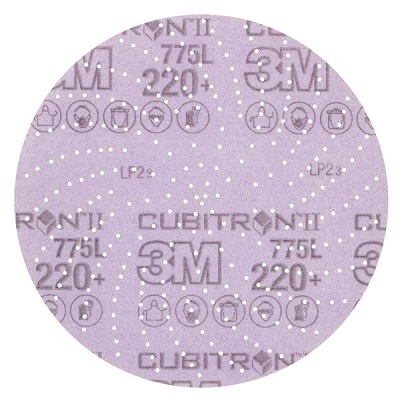 Runde, lila Schleifscheibe mit feinen, gleichmäßig verteilten weißen Schleifkörnern. Sichtbar: '3M Cubitron II', Typ '775L', Körnung '220+'. Aufdruck mit Arbeitsschutzsymbolen wie Schutzbrille und Handschuhe.